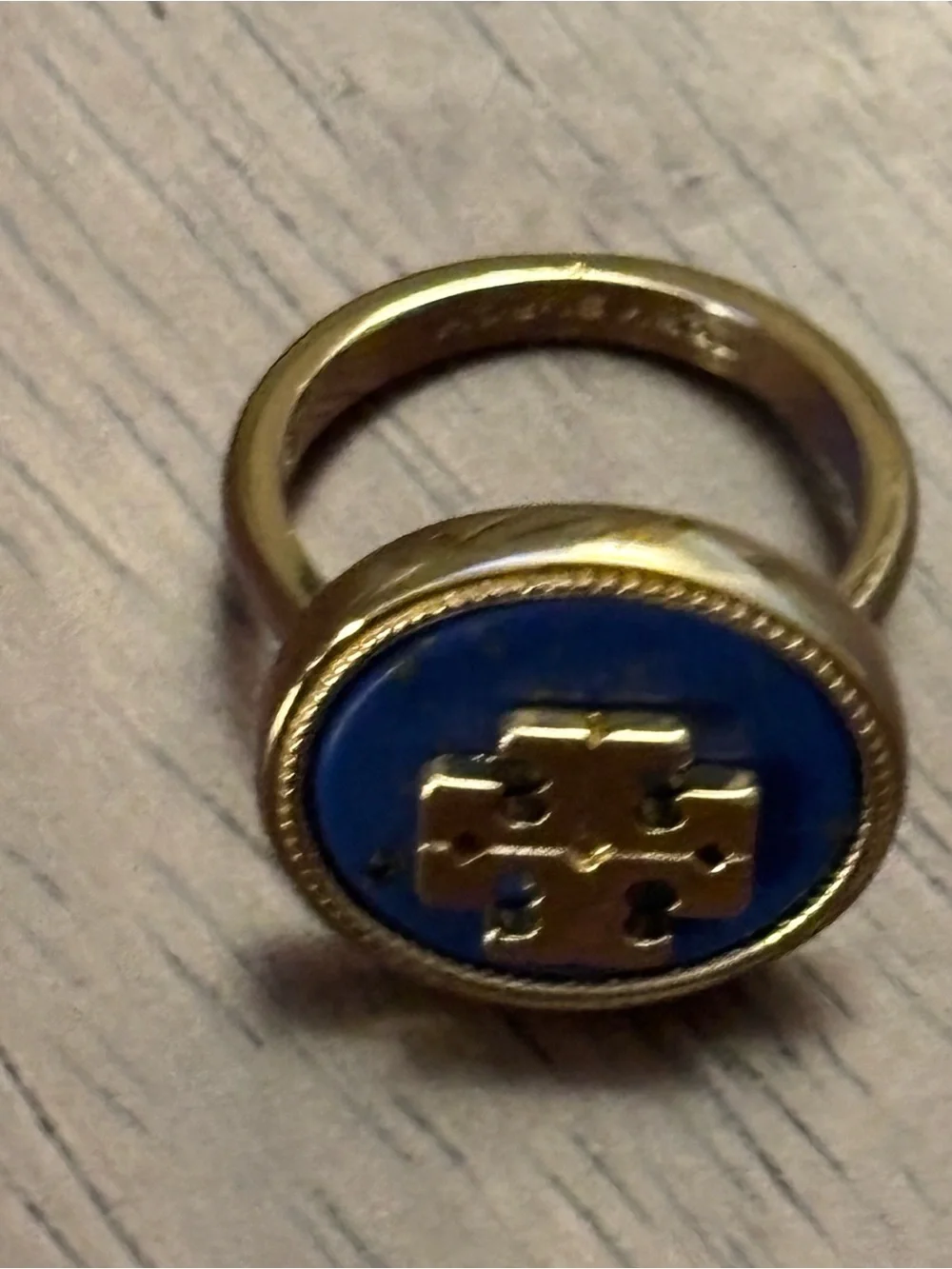 Tory Burch Gold-plated Ring with Deep Blue cover Logo.